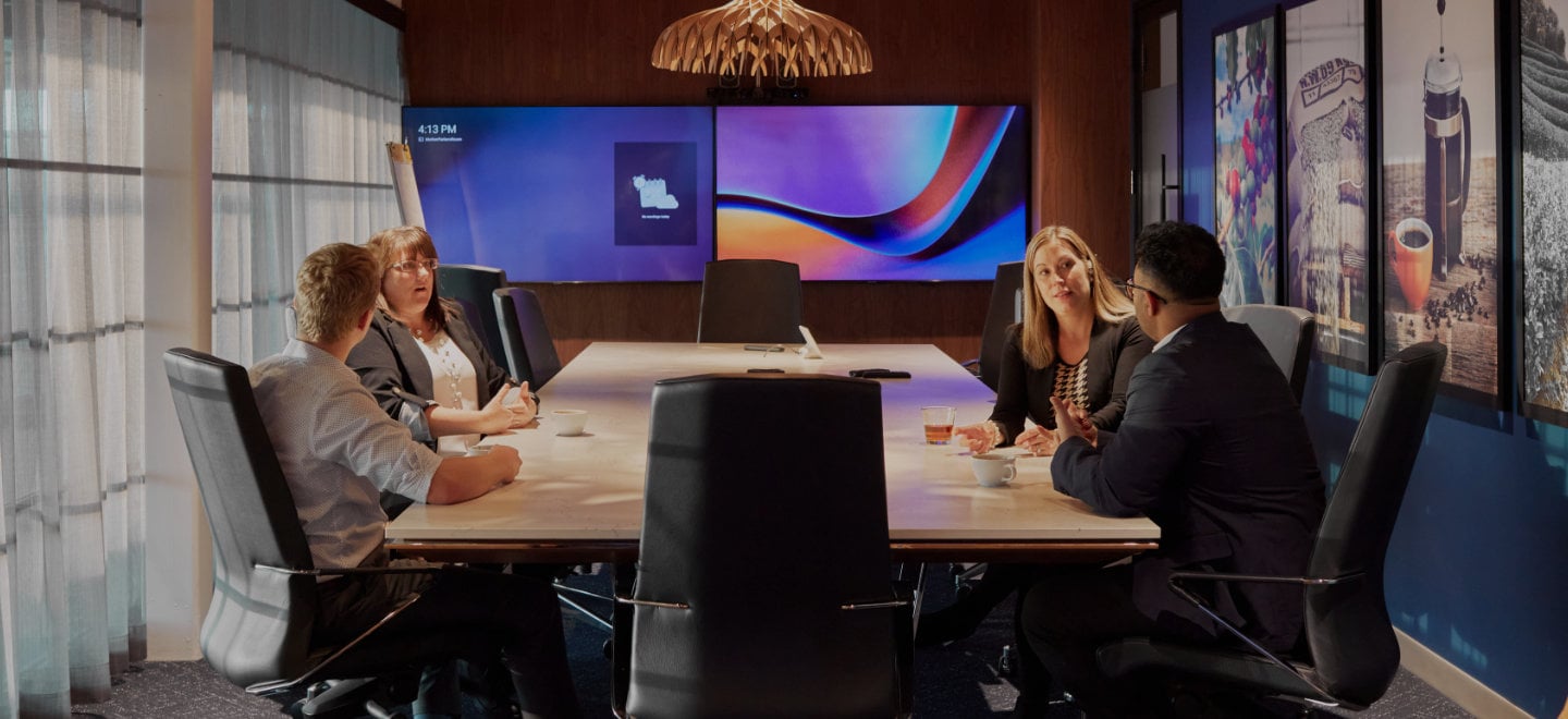 Employees at a boardroom table