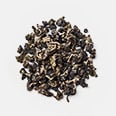 Small custer of dark brown, dry tea leaves