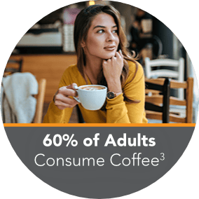Woman in a café enjoying a specialty coffee in a mug